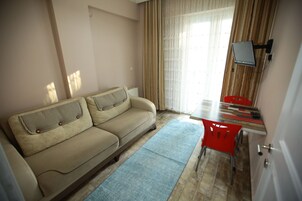 Comfort Apartment, 1 Bedroom, Kitchen, City View | Living room | 55-cm LCD TV with satellite channels, TV, heated floors