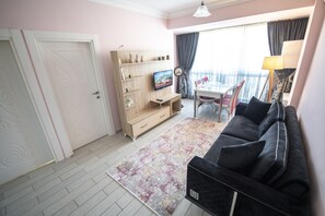 Deluxe Apartment, 1 Bedroom | Living area | LCD TV