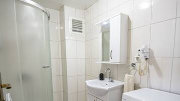 Shower, free toiletries, hair dryer, slippers