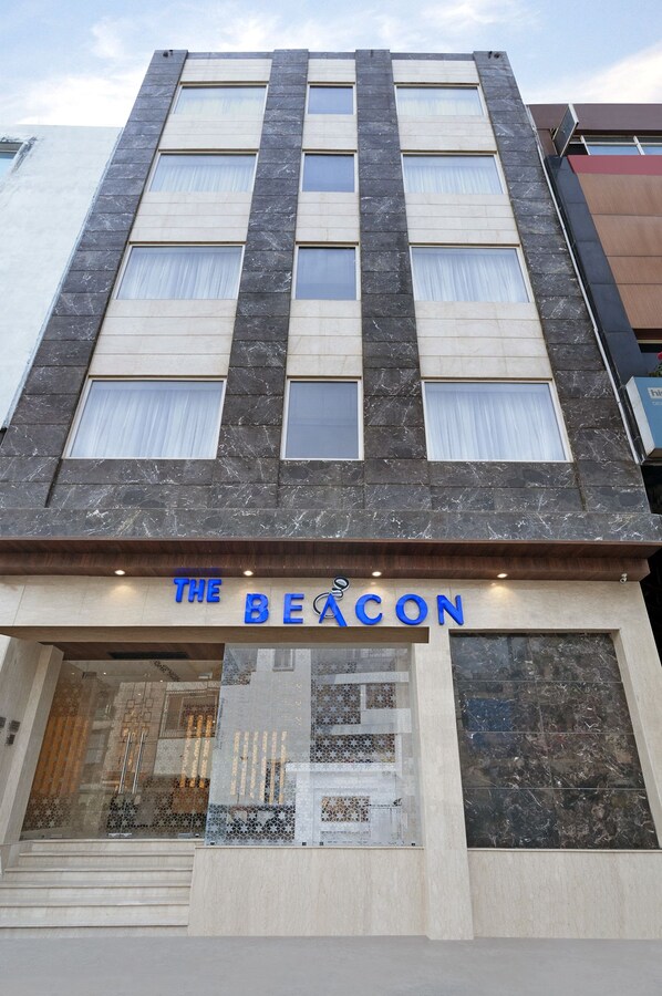 A building with a sign reading "THE BEACON". - Beacon Hotel Nirman Vihar New Delhi (New Delhi)