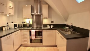 Apartment, 2 Bedrooms | Private kitchen | Full-size fridge, microwave, oven, stovetop