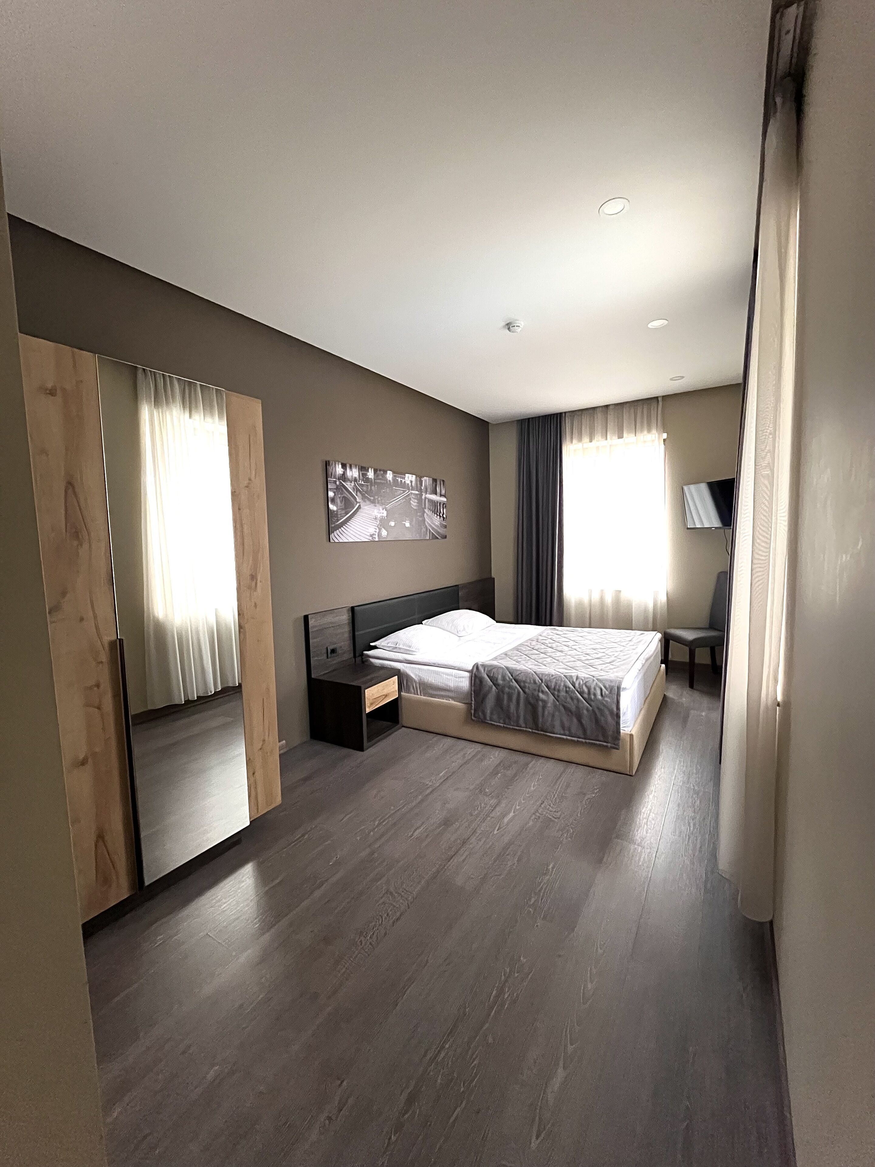 economy double room | premium bedding, minibar, in-room safe, desk