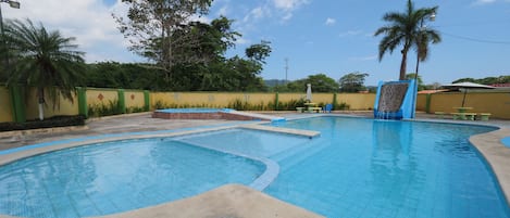 Outdoor pool, pool umbrellas, pool loungers