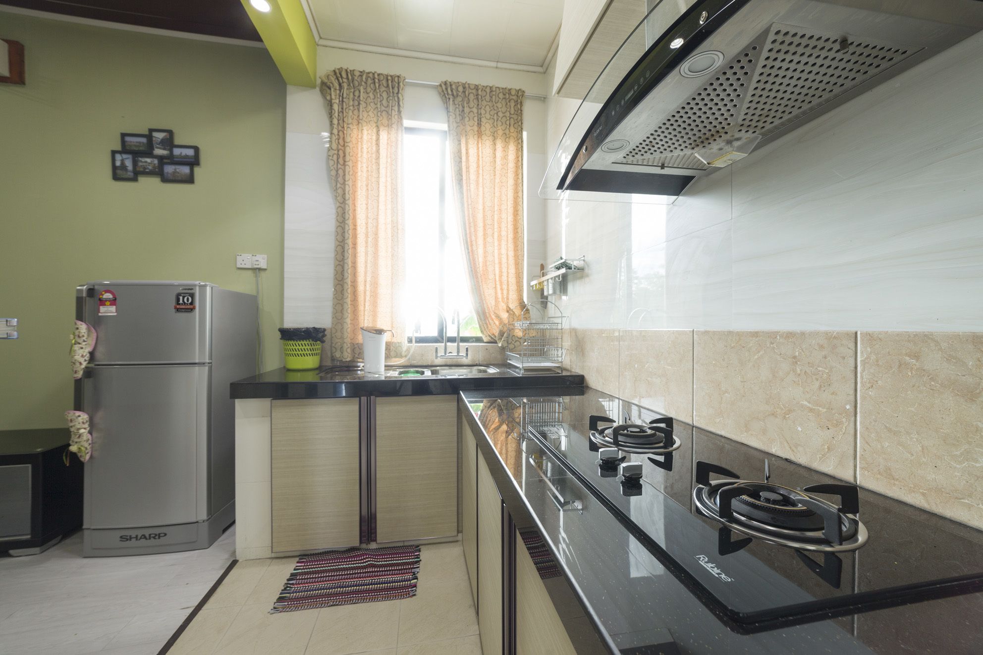 Full-sized fridge, stovetop, rice cooker, cookware/dishes/utensils