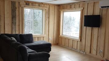 Panoramic Chalet, Multiple Beds, River View, Overwater | Living room | Flat-screen TV