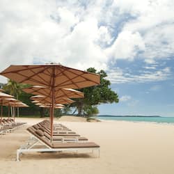 On the beach, sun-loungers, beach umbrellas, beach volleyball
