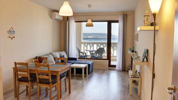 Panoramic Apartment, 2 Bedrooms, Sea View | Living area | Flat-screen TV