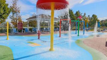 Outdoor pool, a heated pool, pool umbrellas, pool loungers