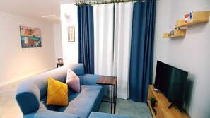 Dúplex | Sala de estar | Televisión de pantalla plana y películas con cargo