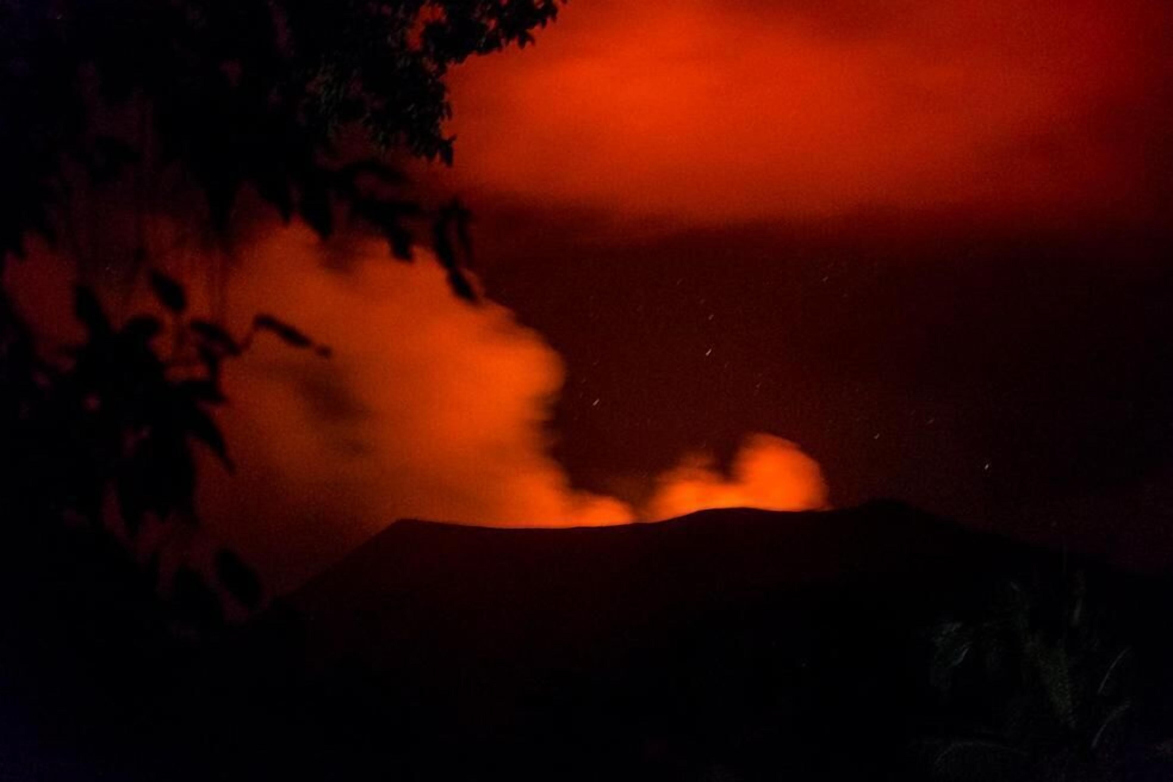 A volcanic eruption with smoke and lava visible.