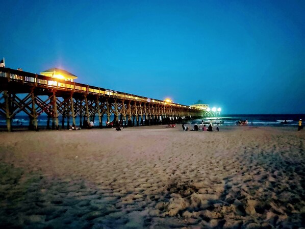 Stroll along the pier, taking in the serene ocean views.