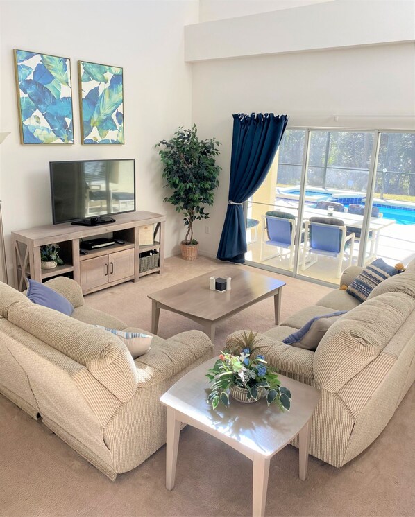 Living area - 2 Master Suites and a Private South Facing Pool with a Forest View with a Games Room for the kids. (Kissimmee)