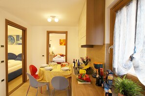 Enjoy a meal for two in this cozy space with a dining area and comfortable seating.