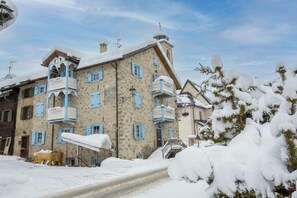 A multi-story building with balconies and a snow-covered environment. - Zaffiro Ski in, Livigno, Italy (Livigno)