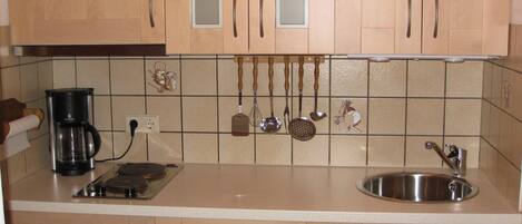 Fridge, microwave, stovetop, coffee/tea maker