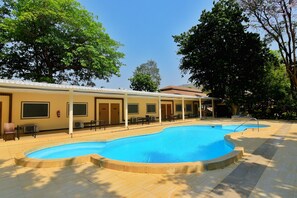 Outdoor pool, open 7:30 AM to 9:00 AM, pool loungers - Suansaiyok Resort (Sai Yok)