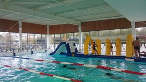An indoor swimming pool with lane dividers, a water slide, and exercise equipment. - Charming south facing house completely renovated with garden (Dives-sur-Mer)