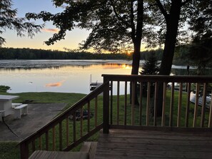 A wooden deck with a railing overlooking a calm lake at sunset. -
Enjoy Our Cabin And Sunsets, On Peaceful , Non-Motorized Lulu Lake (Shawano)