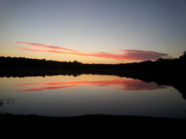 A calm lake reflecting a sunset sky with clouds. -
Enjoy Our Cabin And Sunsets, On Peaceful , Non-Motorized Lulu Lake (Shawano)