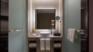 A modern bathroom with a round sink, a large mirror, and a towel rack. - Prolit Lanke Hotel (Chengdu)