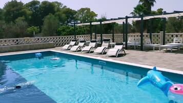 Seasonal outdoor pool, open 10:30 AM to 7:00 PM, pool umbrellas