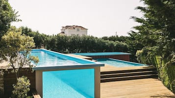 Indoor pool, outdoor pool, pool umbrellas, pool loungers