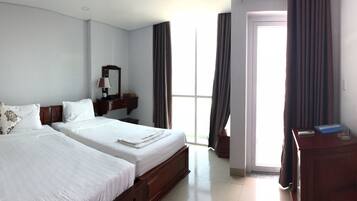 Deluxe Triple Room, Balcony | In-room safe, desk, blackout curtains, rollaway beds