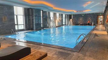 Indoor pool, open 6:30 AM to 11:30 PM, sun loungers, lifeguards on site