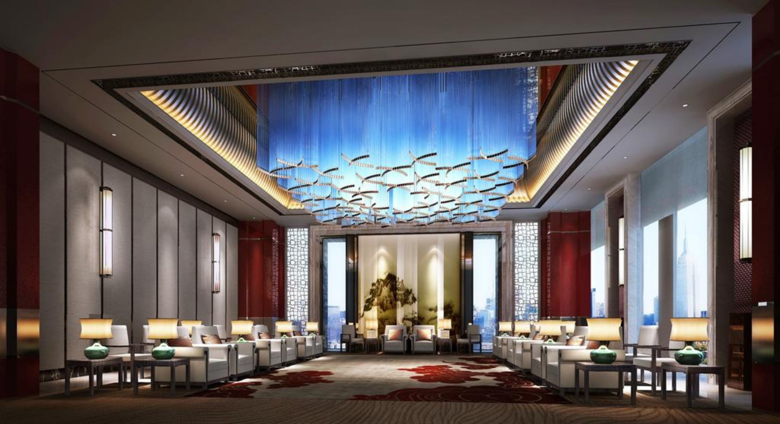 A spacious lobby with a central seating area, a patterned carpet, and a ceiling with a unique light fixture.