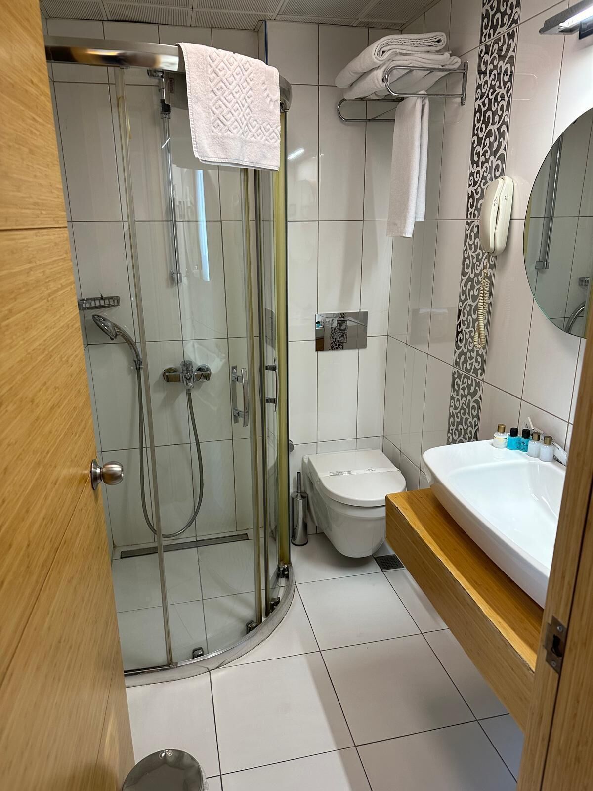 family room | bathroom | shower, rainfall showerhead, free toiletries, hair dryer