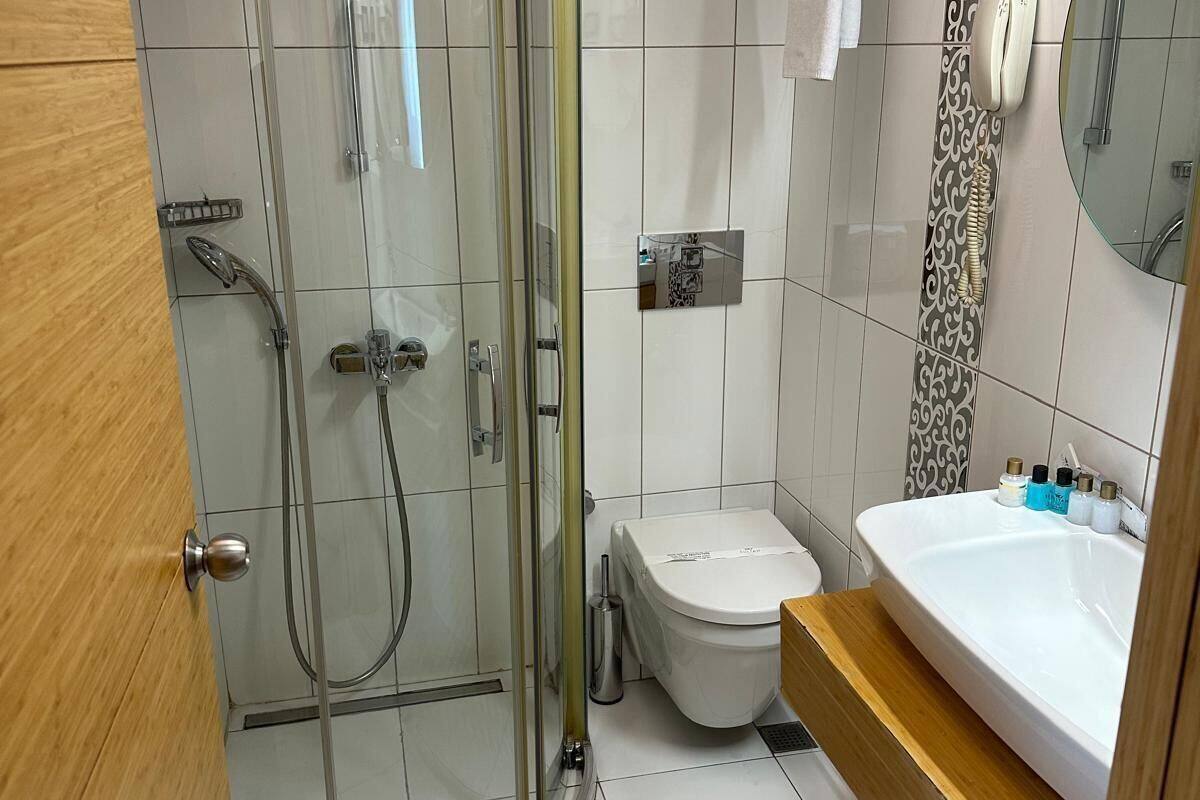 family room | bathroom | shower, rainfall showerhead, free toiletries, hair dryer