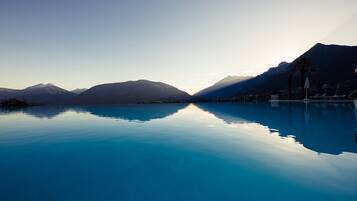 Indoor pool, outdoor pool, pool umbrellas, pool loungers