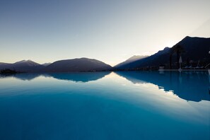 Indoor pool, outdoor pool, pool umbrellas, pool loungers