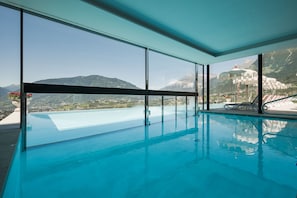 Indoor pool, outdoor pool, pool umbrellas, pool loungers
