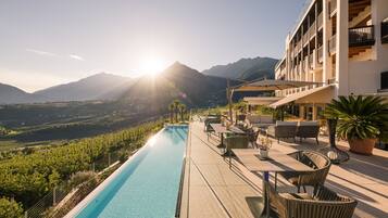 Indoor pool, outdoor pool, pool umbrellas, pool loungers