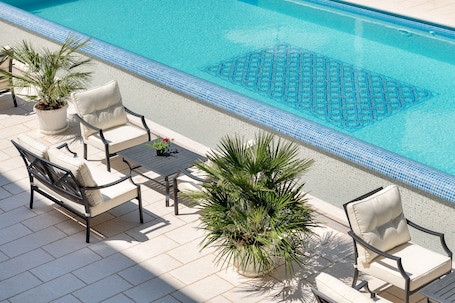 Indoor pool, outdoor pool, open 8:00 AM to 8:00 PM, pool umbrellas