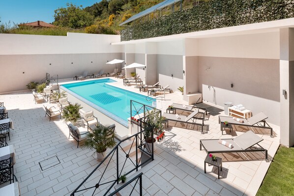 Indoor pool, outdoor pool, open 8:00 AM to 8:00 PM, pool umbrellas