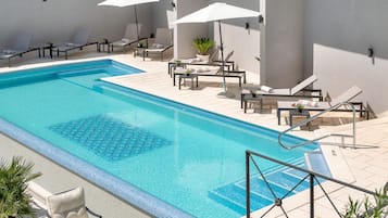 Indoor pool, outdoor pool, open 8:00 AM to 8:00 PM, pool umbrellas