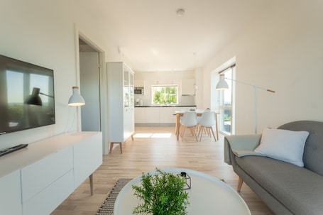 Apartment, 1 Bedroom | Living area | Smart TV, heated floors