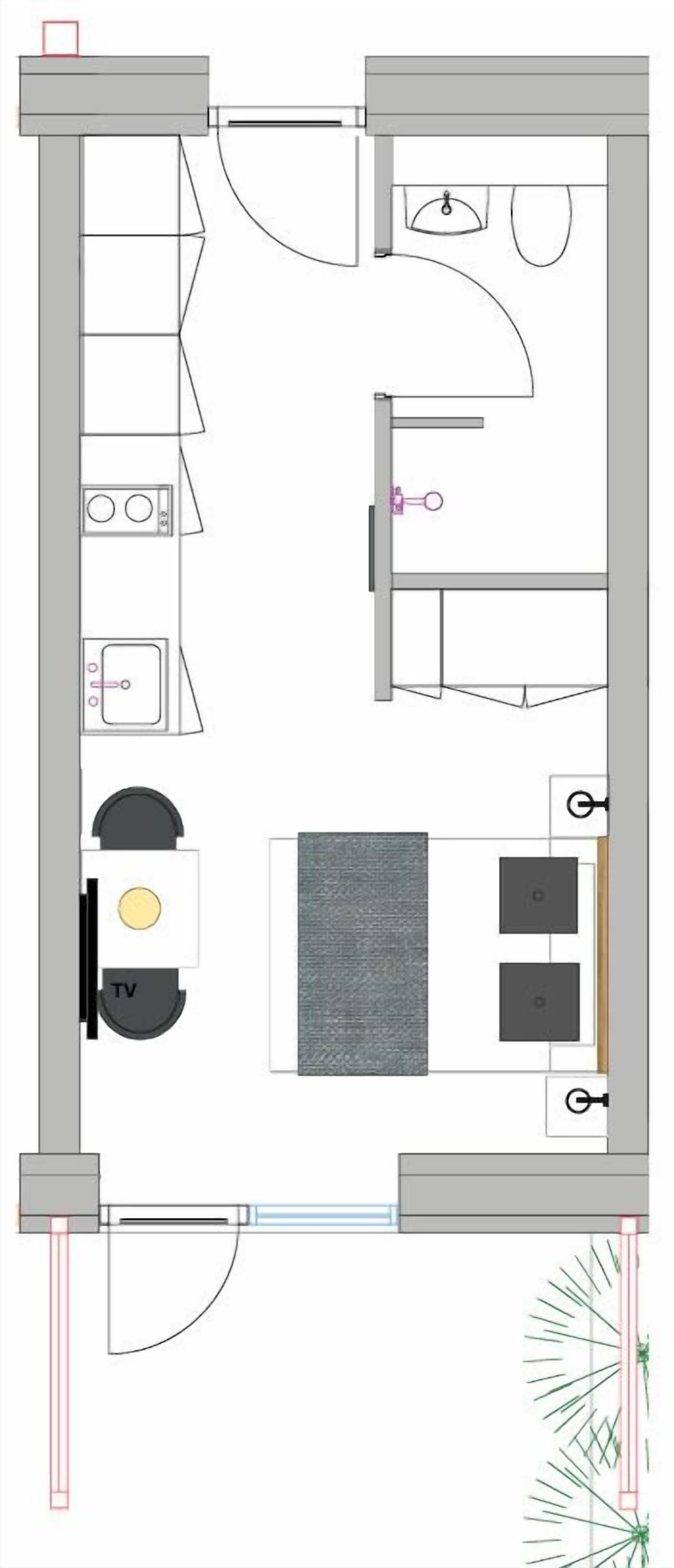 Planta baixa de um quarto de hotel com cozinha compacta, TV, área de estar e banheiro.