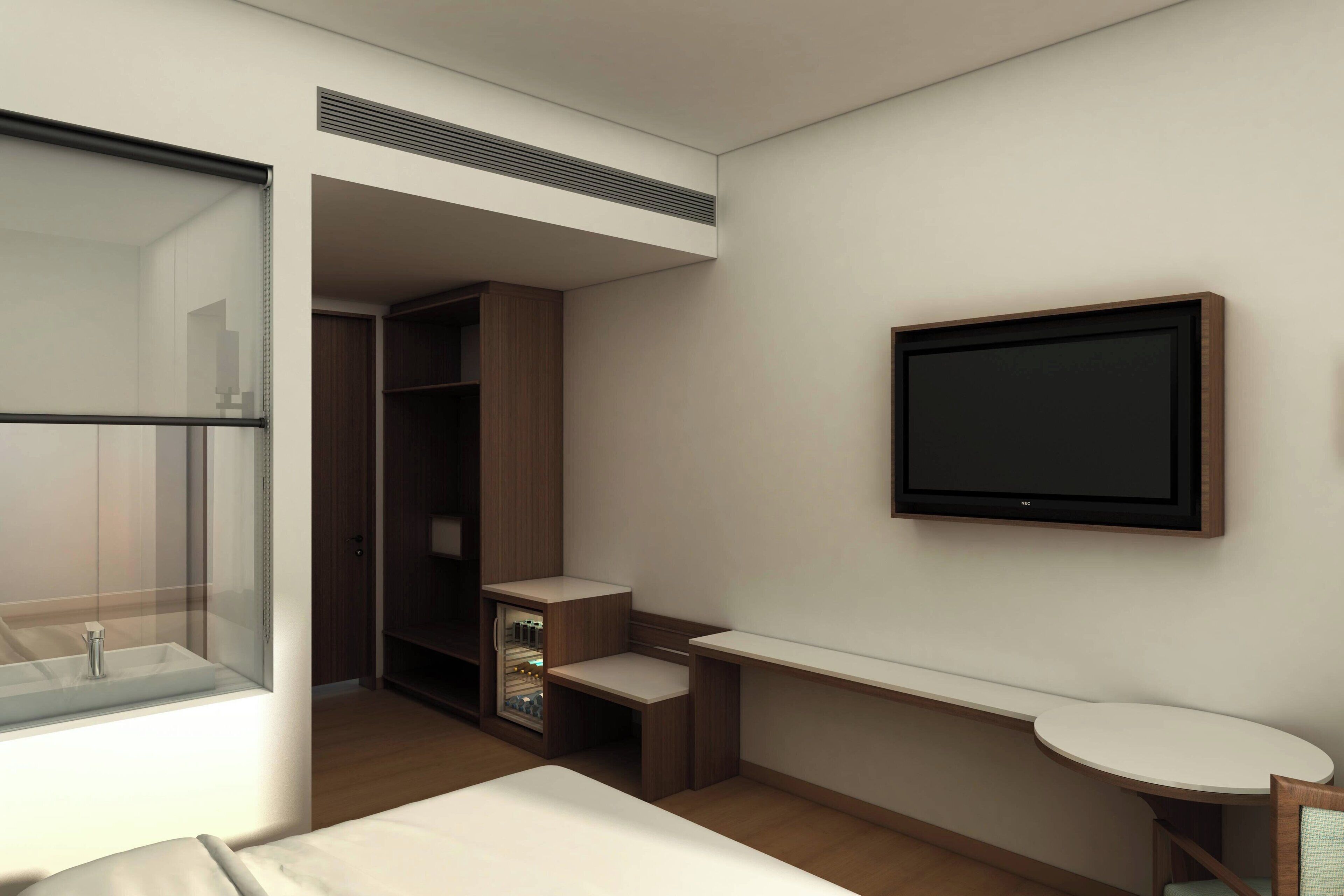 Ein modernes Hotelzimmer mit Duschkabine aus Glas, integriertem Kleiderschrank, flachbildfernseher an der Wand und einem kleinen Nachttisch.