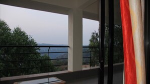 A balcony with a view of the landscape.