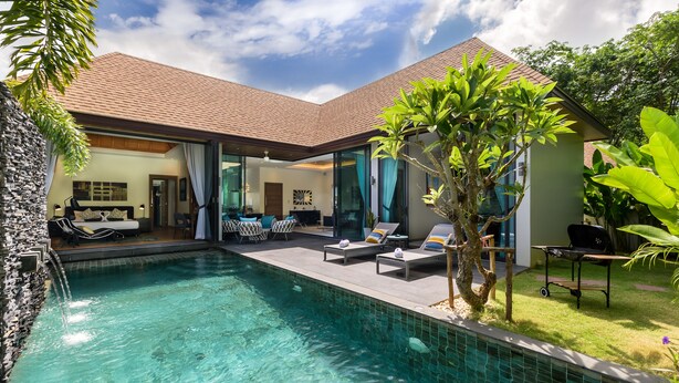 A modern house with a swimming pool, outdoor seating, and a well-maintained garden. - Inspire Villas Phuket (Rawai)