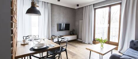 Premium Apartment, 1 Bedroom, Balcony | Living area | Flat-screen TV