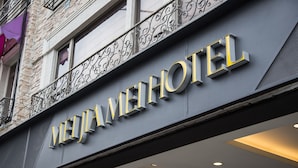 A hotel sign with the name "MEIJIA HOTEL" in large, bold letters. - Mei Jia Mei Hotel (Jiaoxi)