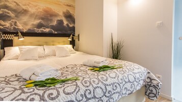 Deluxe Apartment, 1 Bedroom | 1 bedroom, iron/ironing board, free cribs/infant beds, travel crib