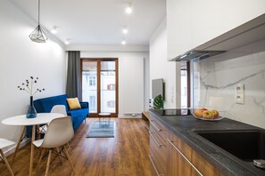 Classic Apartment, Balcony | Living room | Flat-screen TV