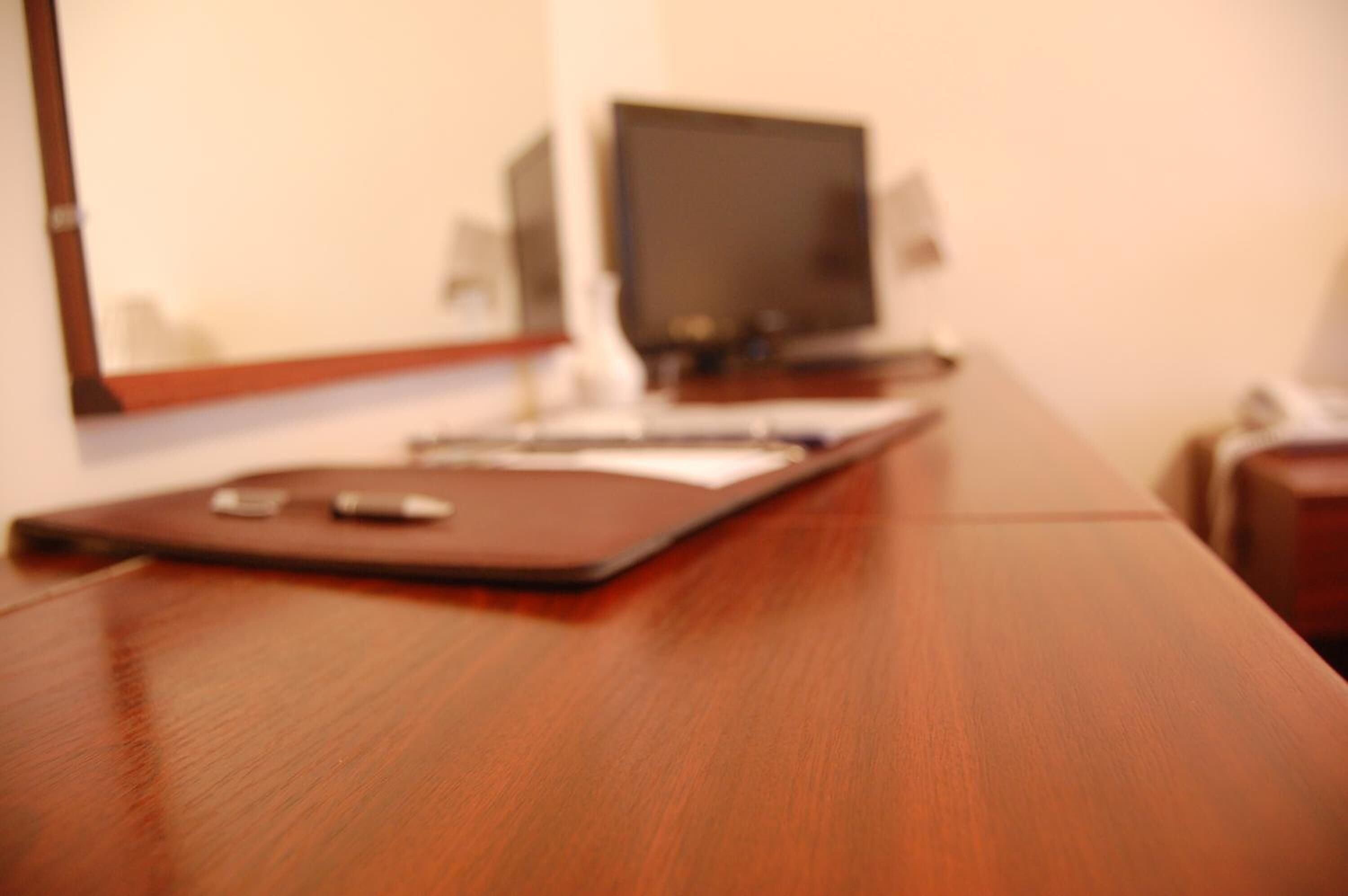 desk, iron/ironing board, bed sheets