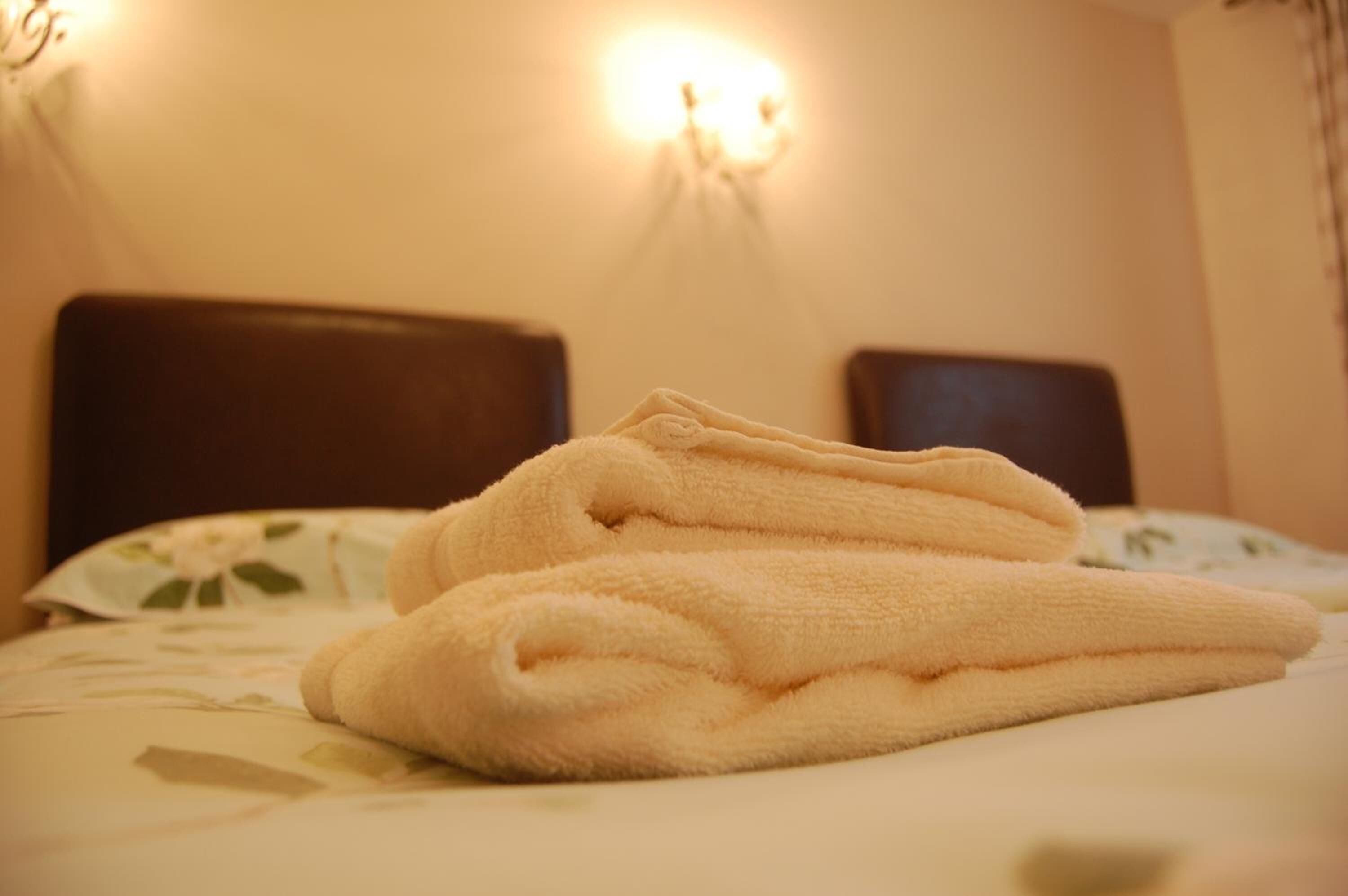 desk, iron/ironing board, bed sheets