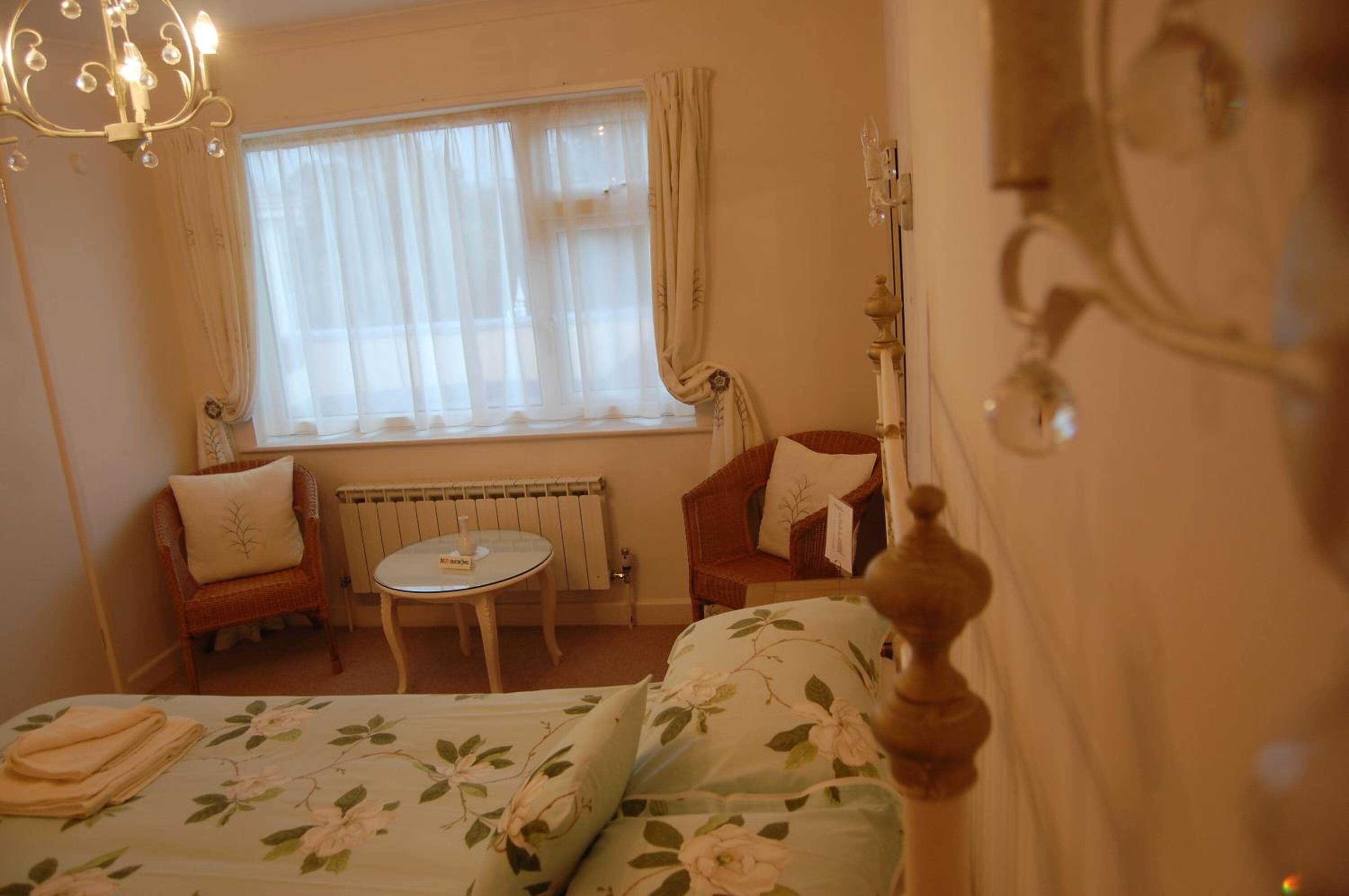 desk, iron/ironing board, bed sheets